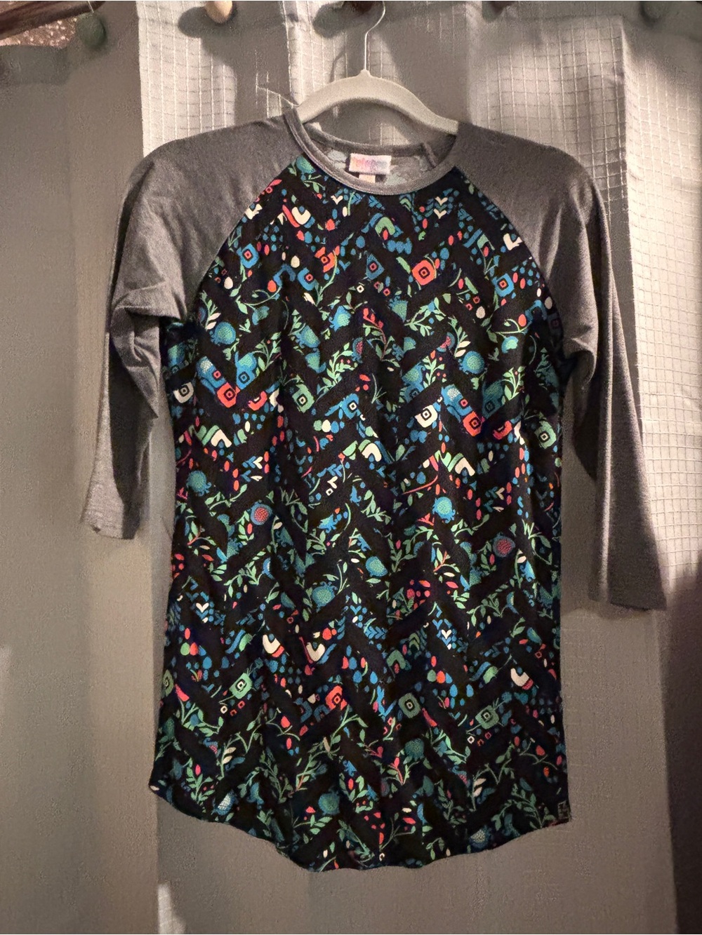 LuLaRoe Black Tee with Blue, Green, Red & White Floral Geometric Print